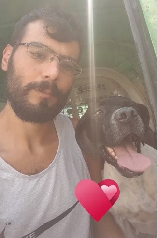 Co-founder Joe with a passenger dog in the Pet Taxi